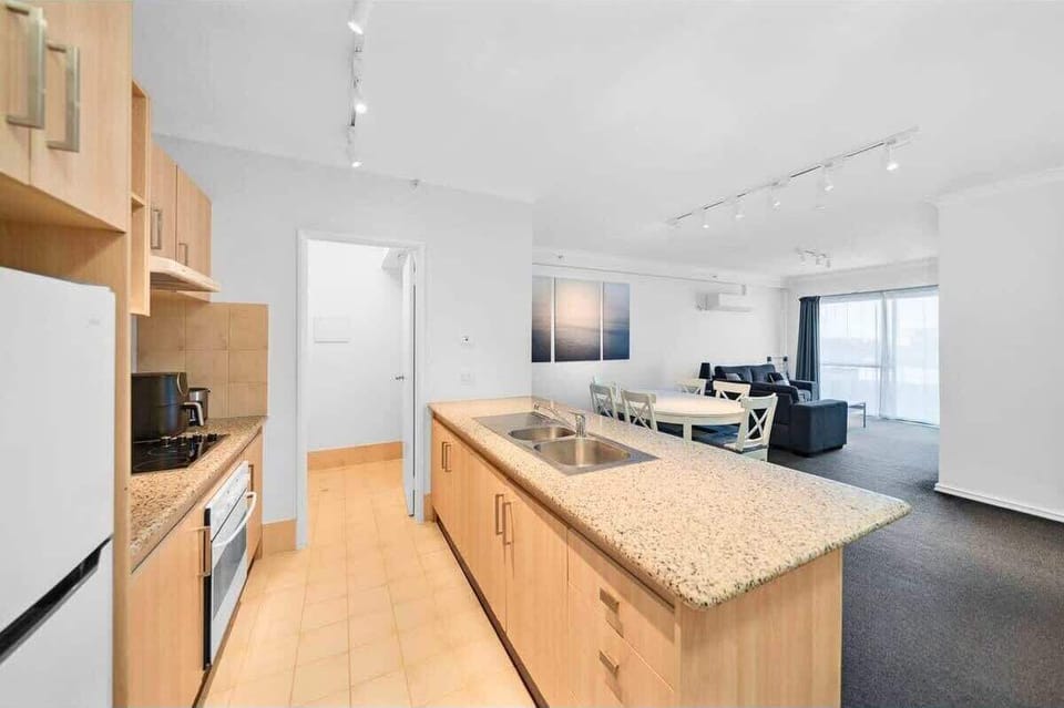 Modern kitchen with granite countertops, open layout, and plenty of natural light.