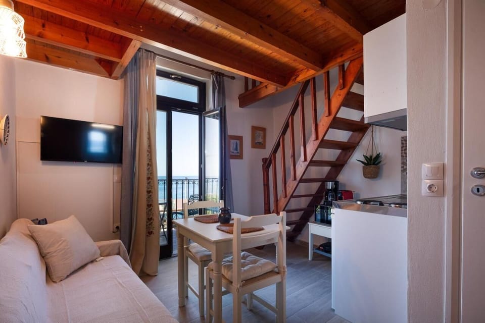 Comfort Apartment, Balcony, Beach View | Living area | Flat-screen TV