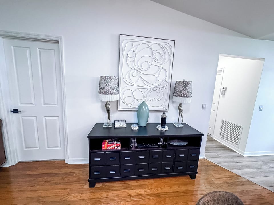 Buffet Cabinet with Master Bedroom to the left and Pantry and Garage Access to the Right