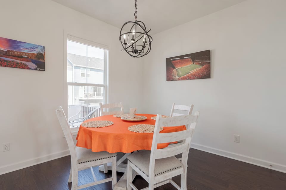 The round dining table comfortably seats four—ideal for dinners or game nights.
