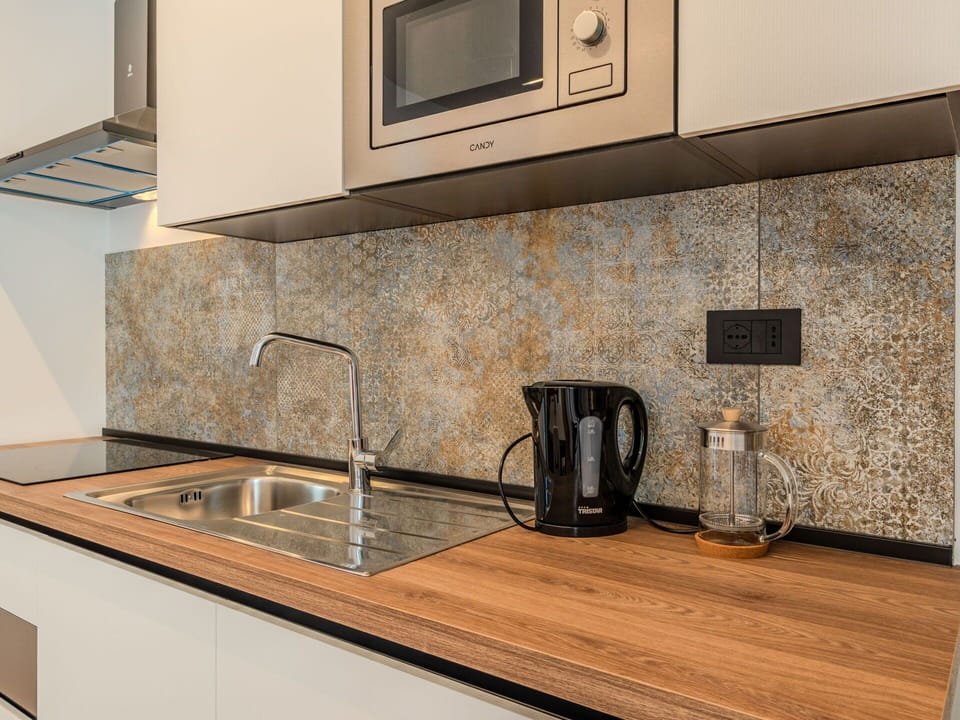 Countertop, Kitchen, Plumbing Fixture, Interior Design, Flooring, Sink, Tap, Cabinetry, Floor, Plumbing