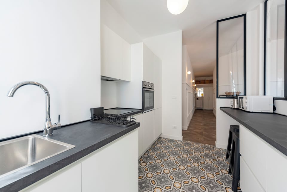 Apartment, 3 Bedrooms, Balcony, Partial Sea View | Private kitchen | Dishwasher, coffee/tea maker, dining tables