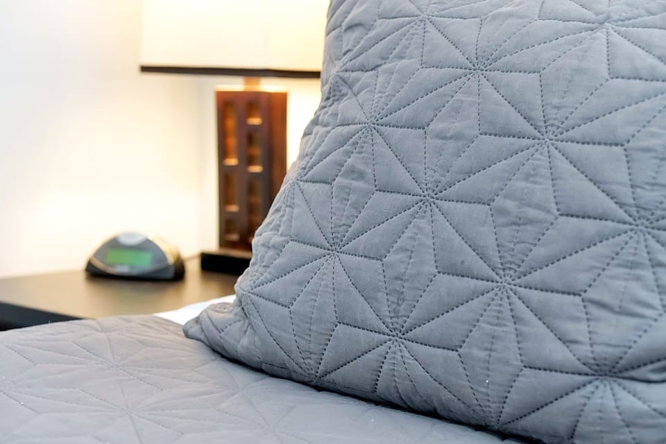 Cozy details make all the difference. Enjoy the high-quality, textured bedding and a bedside clock