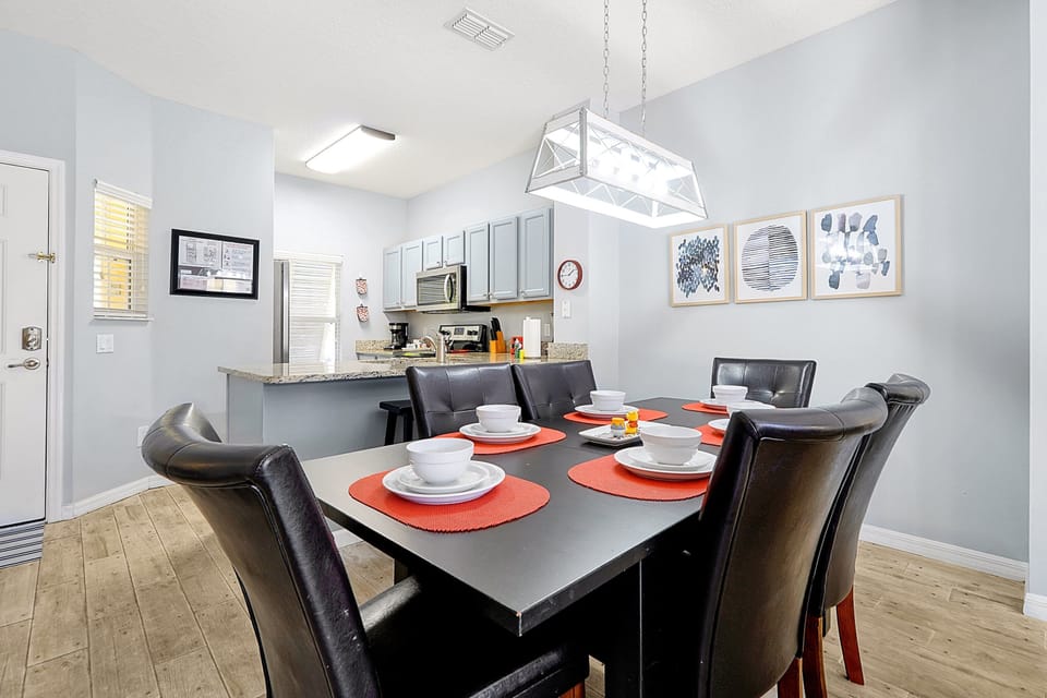 Enjoy family meals together at this stylish dining table, connecting seamlessly to the fully-equipped kitchen. Whether it's a quick breakfast or a full dinner, you'll feel right at home