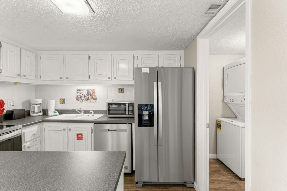 You have an open kitchen concept, which is perfect for having conversations while you cook.