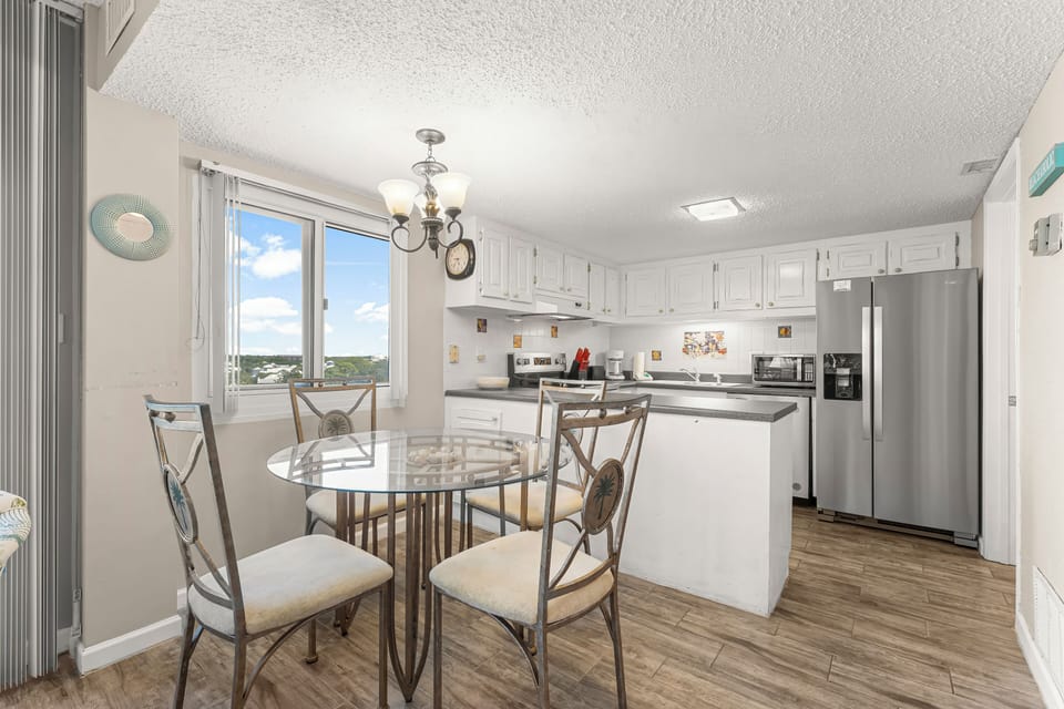 You have a spacious open dining area adjacent to the fully equipped kitchen.