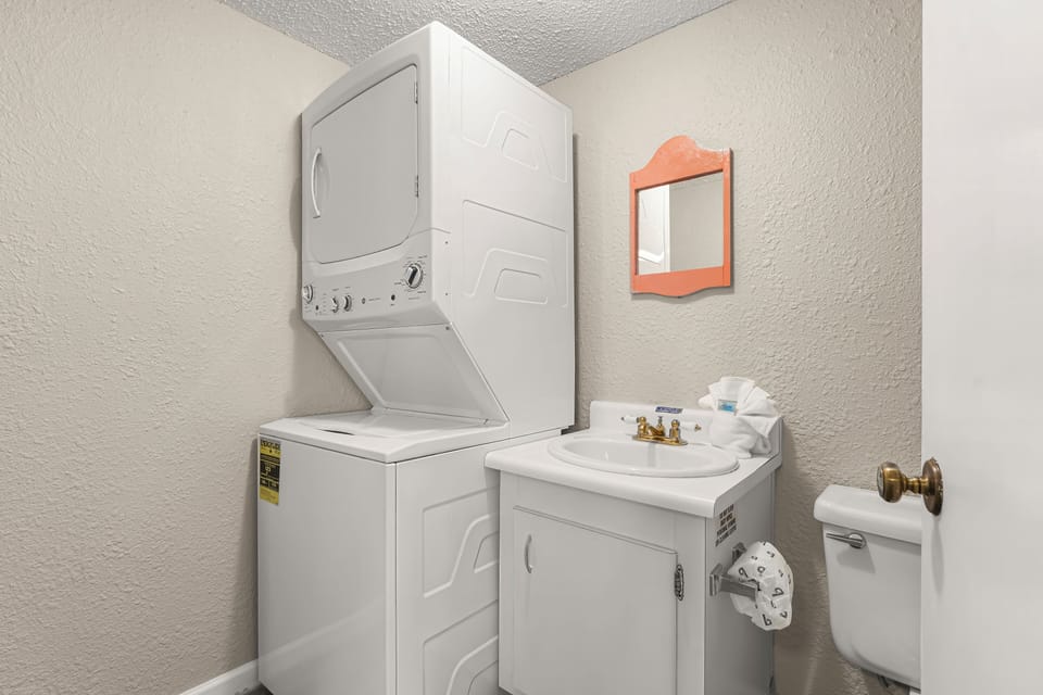 Conveniently located off the kitchen is your laundry and half bath.