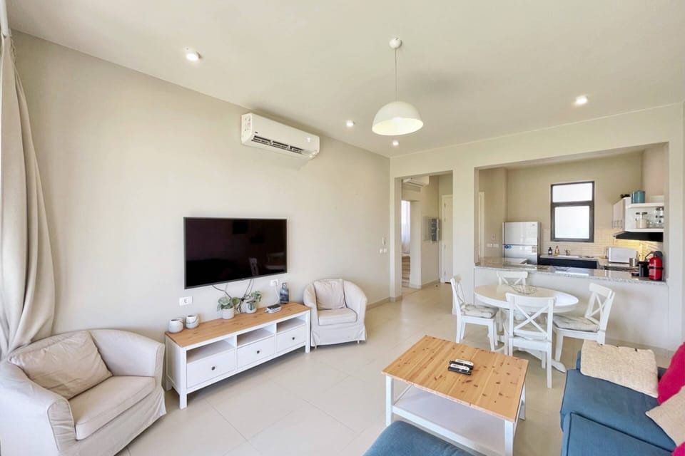 Basic Villa | Living area | 55-inch Smart TV with cable channels
