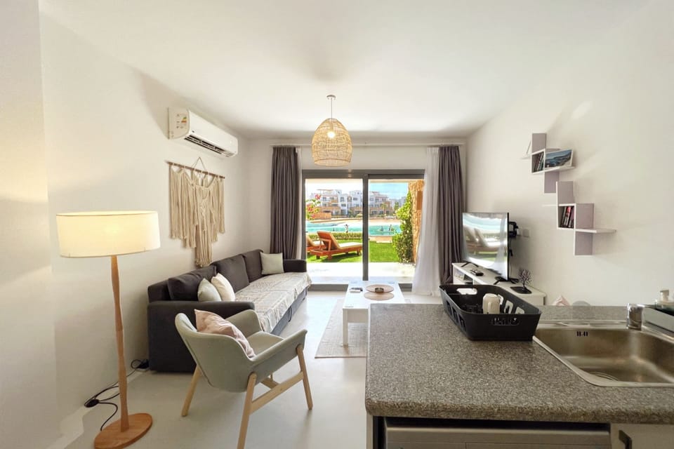 Basic Apartment | Living area | 55-inch Smart TV with cable channels