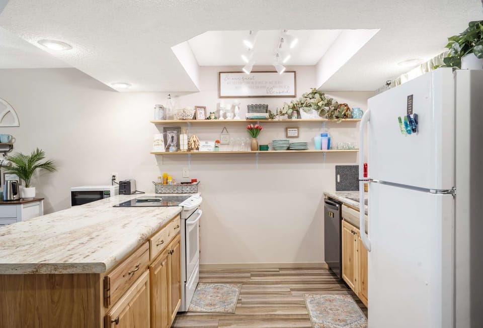 The open kitchen offers ample space & every home comfort