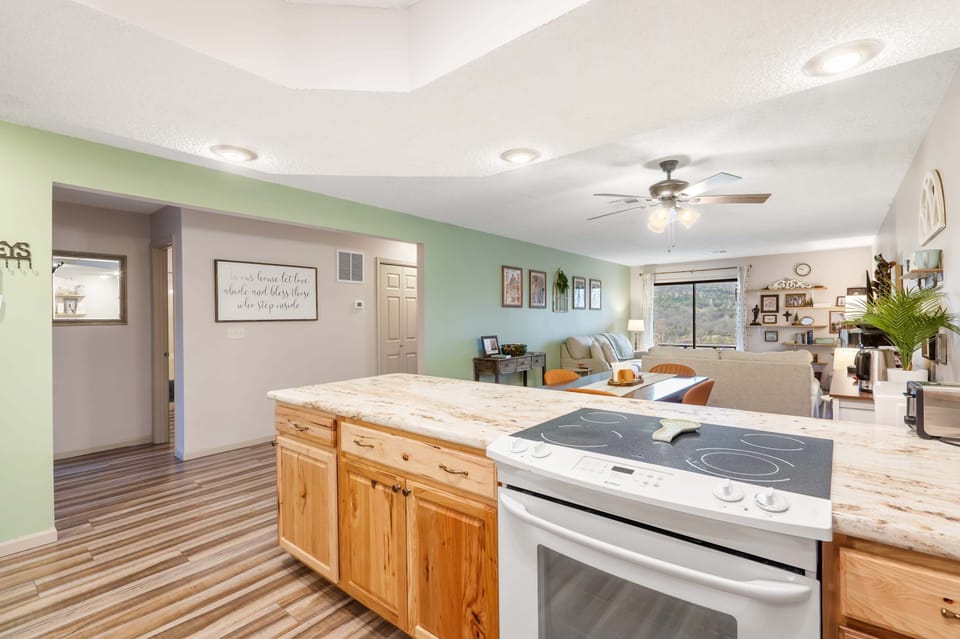The open kitchen offers ample space & every home comfort