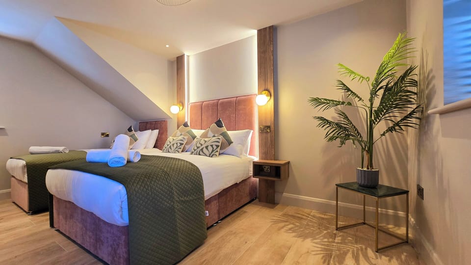 Deluxe Triple Room | Memory foam beds, iron/ironing board, travel crib, free WiFi