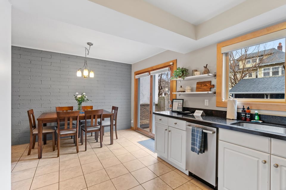 Your bright kitchen flows seamlessly into the dining area, where natural light fills the space and opens to your private patio.