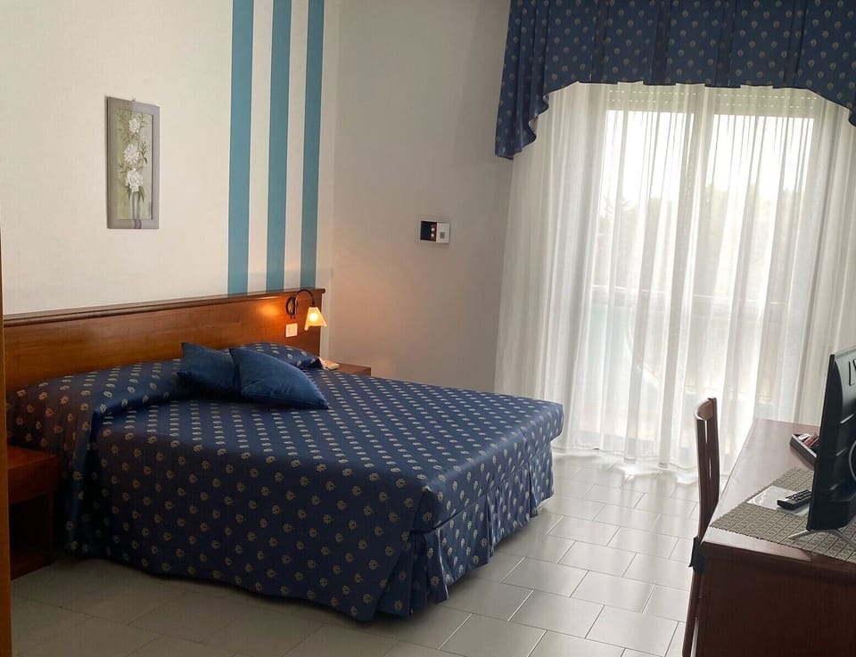 Deluxe Double Room, Balcony | In-room safe, desk, laptop workspace, blackout drapes