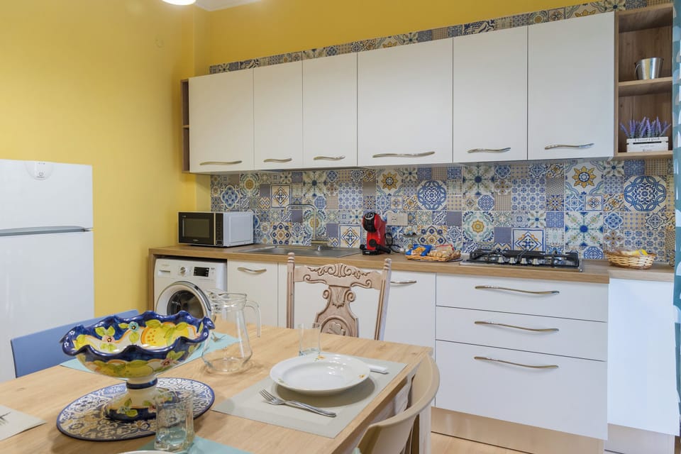 Deluxe Apartment, Balcony | Private kitchen | Full-size fridge, microwave, oven, stovetop