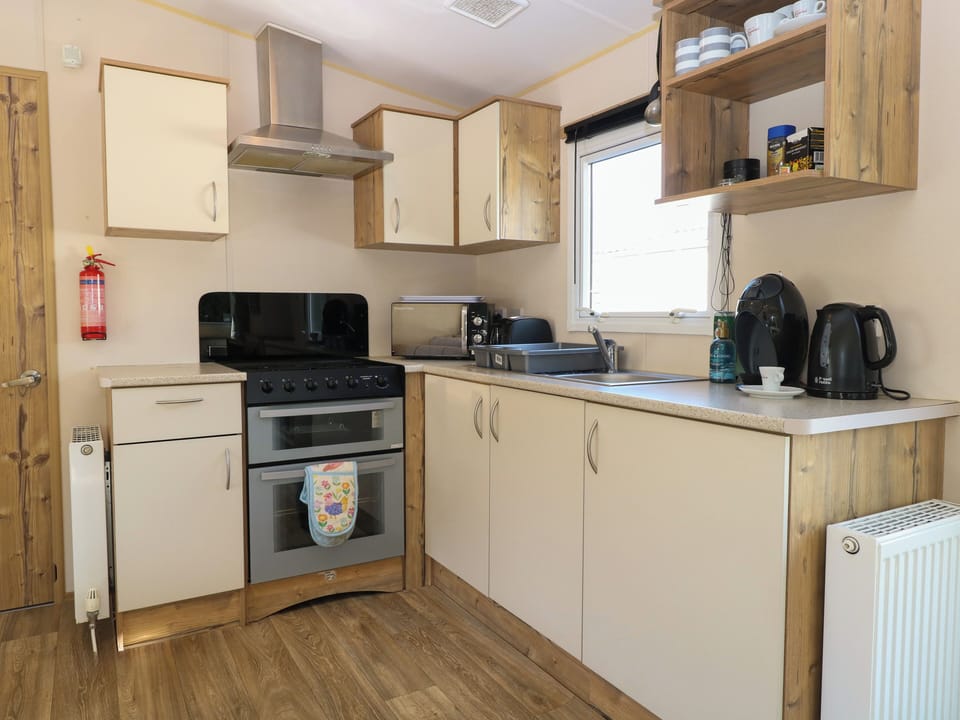 Fridge, microwave, toaster, cookware/dishes/utensils