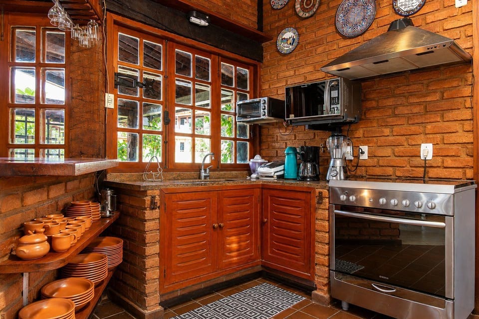 Villa | Private kitchen | Fridge, microwave, oven, stovetop