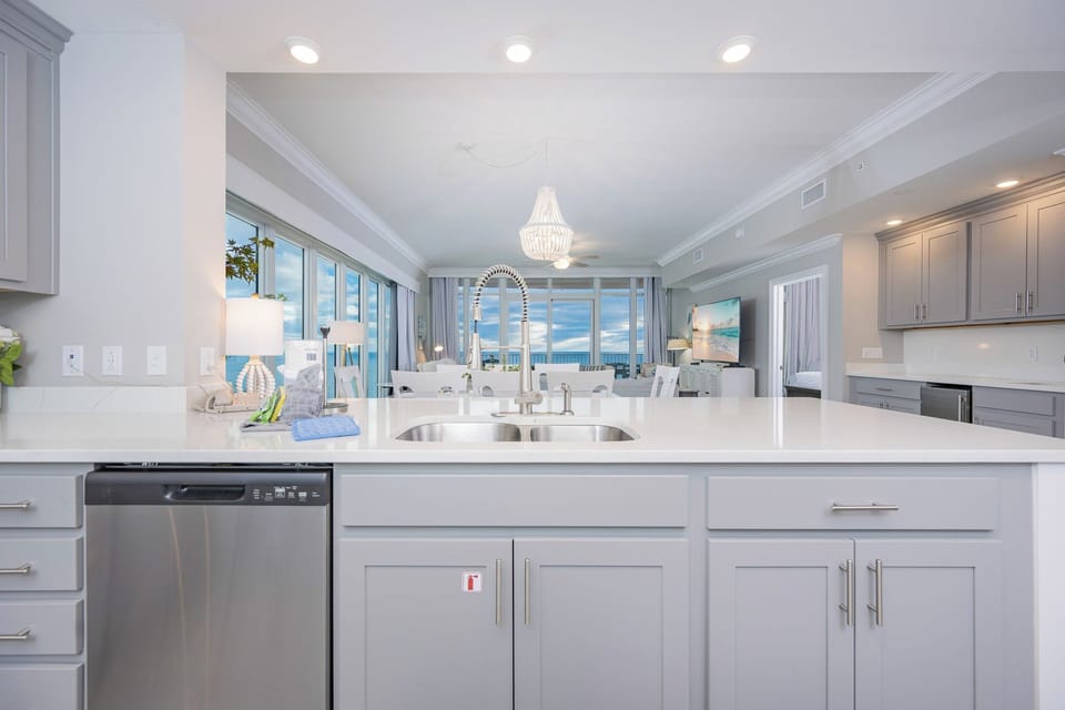 Prepare meals in this kitchen with elegant cabinetry, upgraded appliances, and spacious countertops