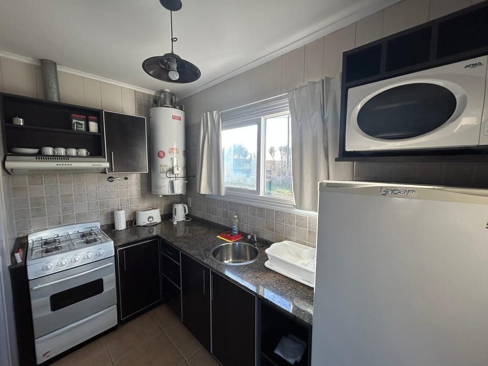 Standard Cabin, Garden View | Private kitchen | Fridge, microwave, cookware/dishes/utensils
