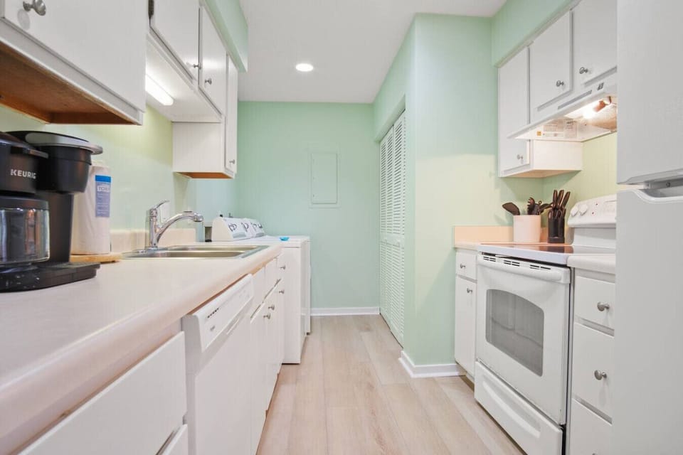 Enjoy a clean, freshly painted kitchen with updated appliances and convenient laundry access
