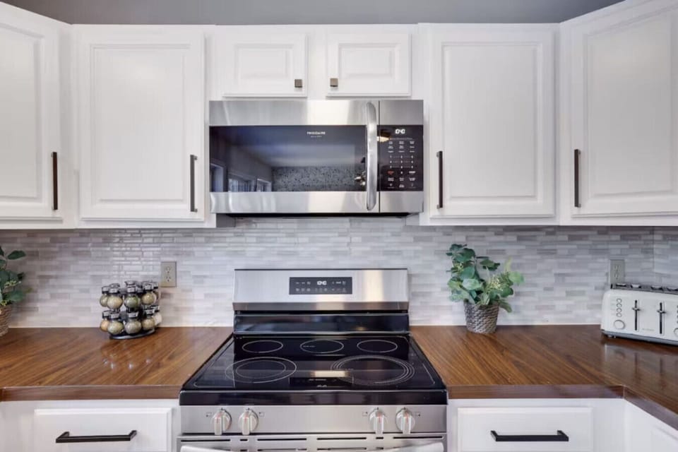 Whip up your favorite meals with ease using the electric stove and microwave—your home away from home kitchen!
