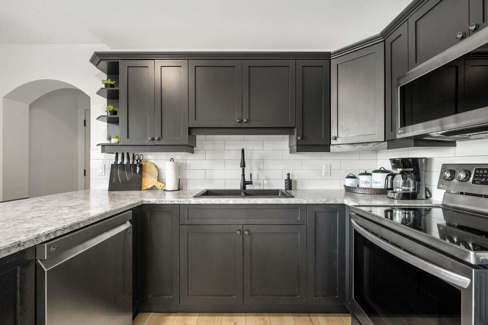 Full kitchen with an electric kettle, instapot, drip coffee maker, ground coffee, tea & sugar.