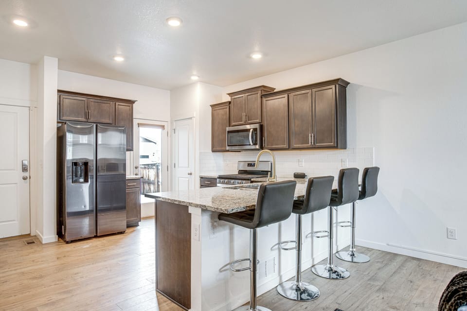 Kitchen | 1st Floor | Stove/Oven | Breakfast Bar | Dishware/Flatware