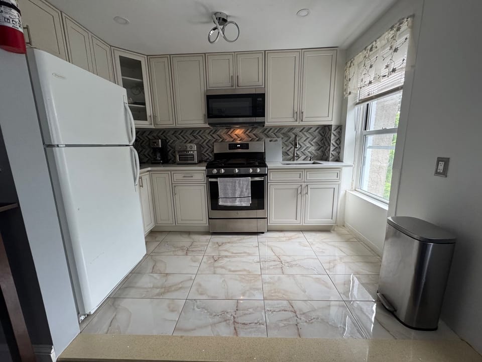 Full kitchen with fridge, freezer, microwave, stove/oven