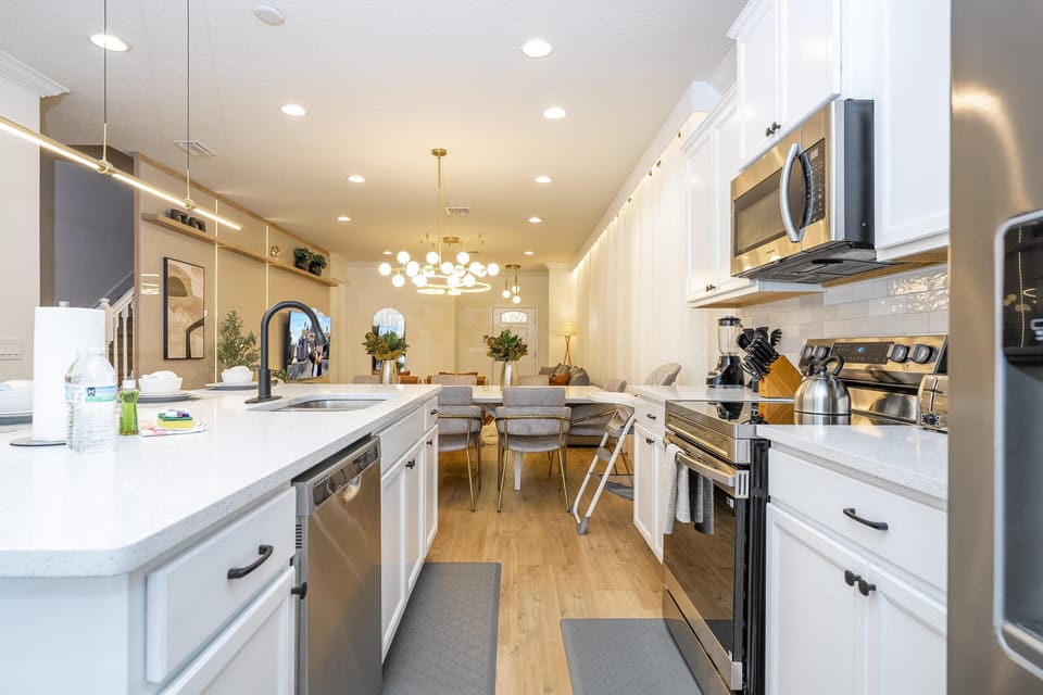 Modern kitchen with spacious island and elegant lighting