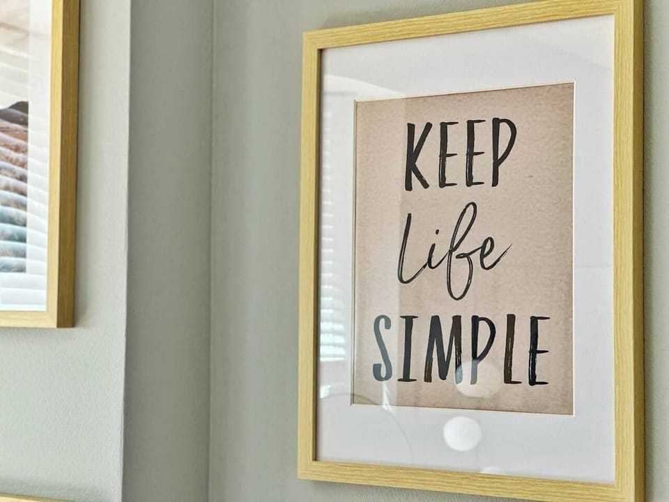 - Inspiring wall art with warm tones creating a cozy welcoming atmosphere  
- Guest friendly decor ideal for short term rental stays  
- Simple message adding charm to your relaxing visit 
