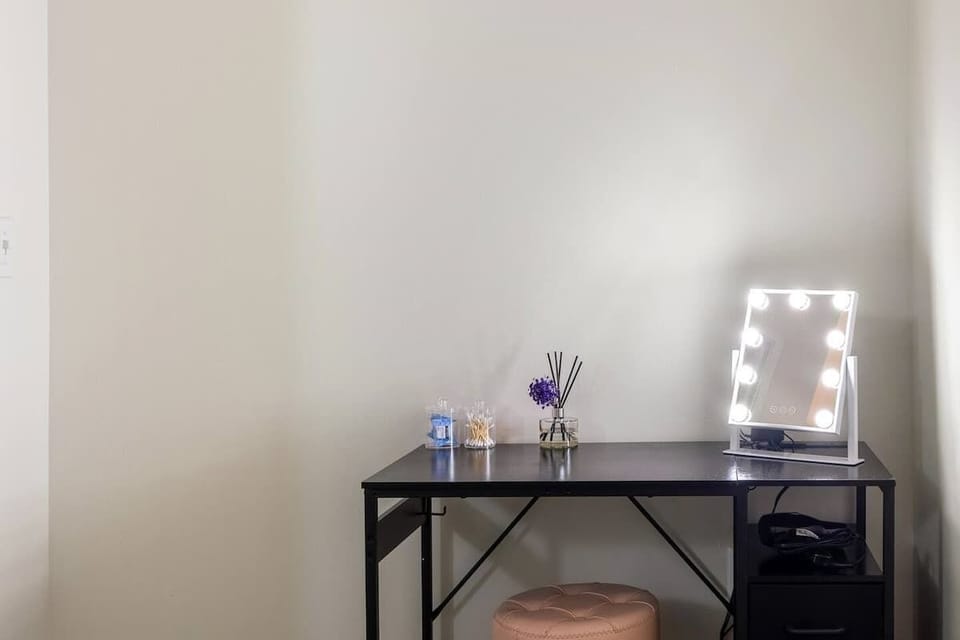 - Cozy vanity corner with soft lighting and modern mirror setup 
- Perfect spot for getting ready with organized counter space 
- Comfortable touch adding extra convenience to any guests stay 
