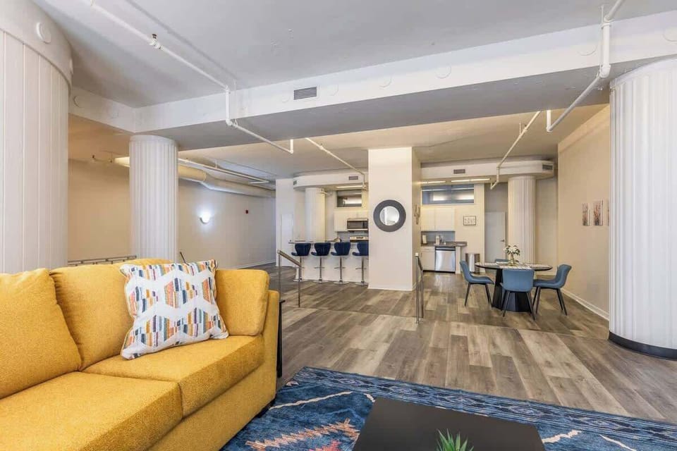 - Spacious open concept layout with bold cozy seating 
- Modern flooring and bright lighting creating a welcoming vibe 
- Stylish living space connecting easily to kitchen and dining areas 
