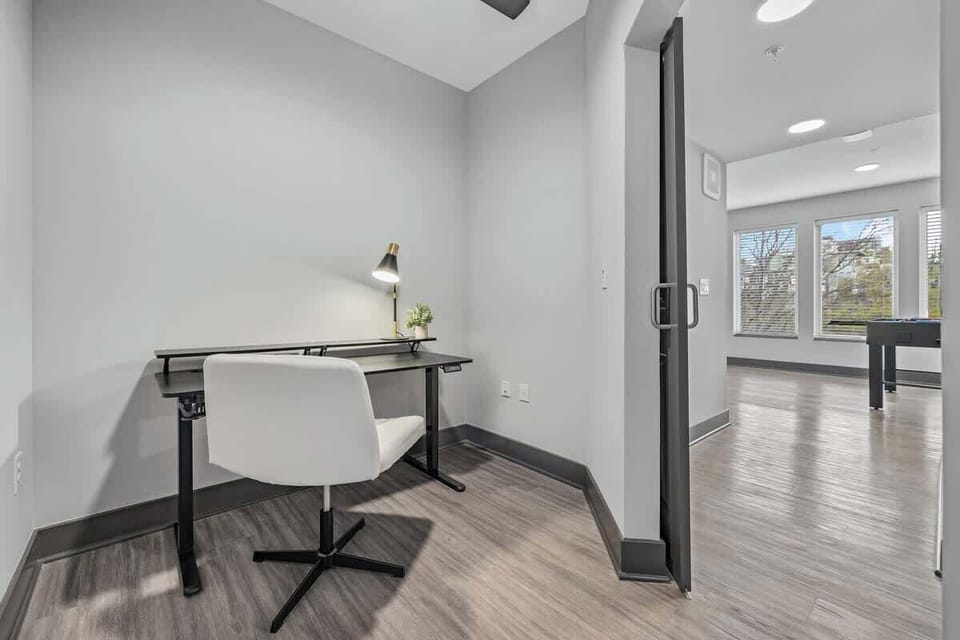 - Quiet workspace with modern desk and bright lighting  
- Perfect corner for remote work or study  
- Clean setup offering focus and productivity  