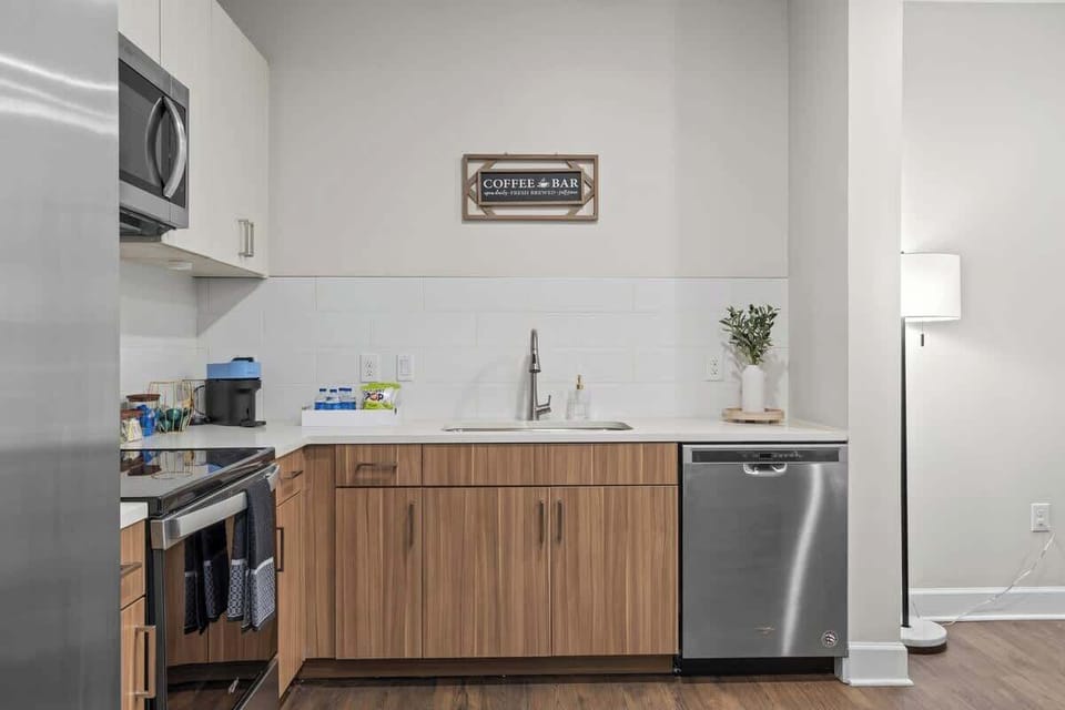 - Updated kitchen with stainless appliances and wood cabinets  
- Bright countertops and essential cookware for easy meals  
- Open layout perfect for comfortable Airbnb living  
