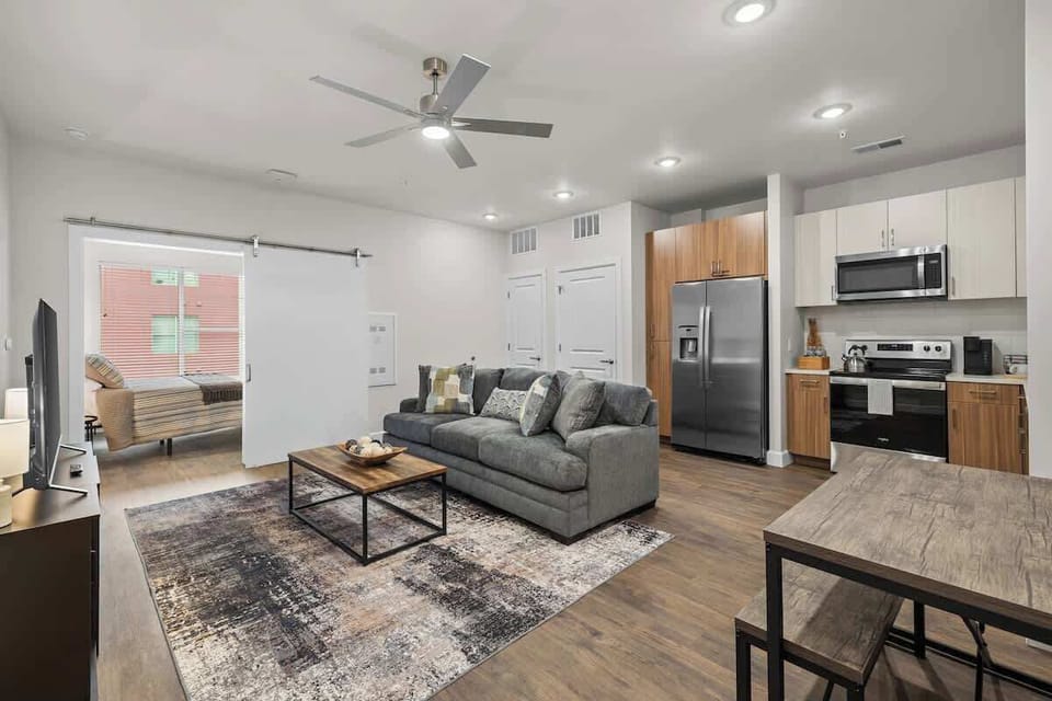 - Open living area with comfy sofa dining table and modern kitchen set  
- Bright spacious layout great for longer visits relaxed stays daily  
- Smooth room flow boosts comfort easy movement and soothing ambiance
