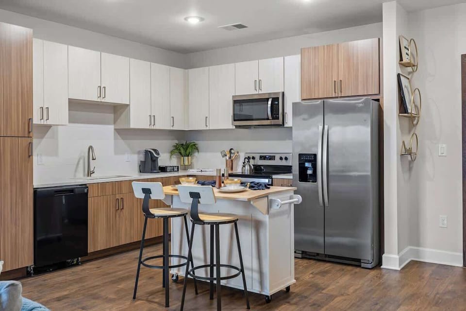 - Modern shared kitchen with stainless appliances and sleek cabinets  
- Spacious island offers a great spot for meals or cooking  
- Ideal setup for longer stays and convenient dining  