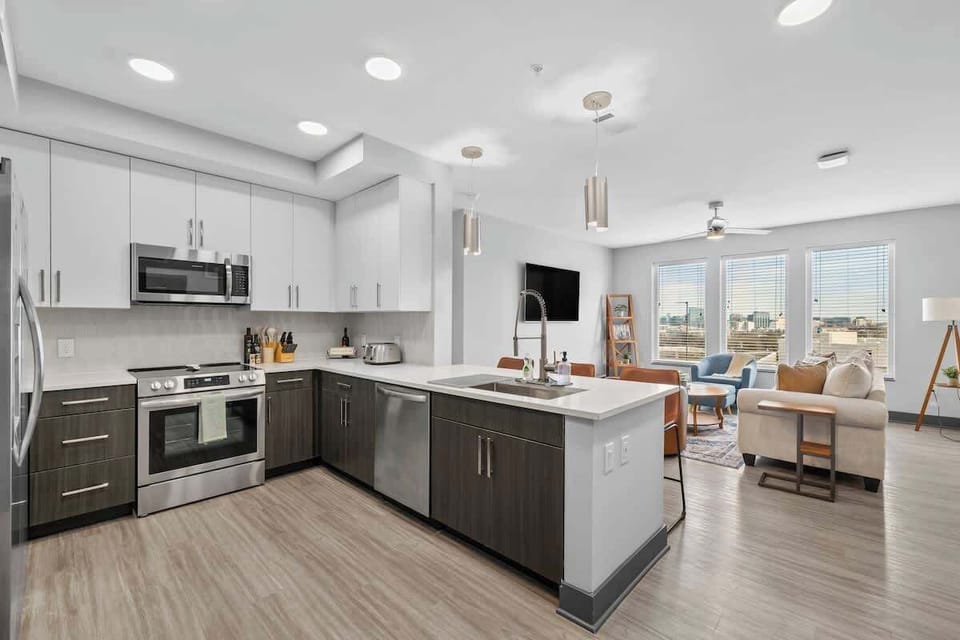 - Modern shared kitchen with full appliances and bright counters  
- Open layout perfect for meal prep and hosting  
- Clean design enhancing your comfortable stay  
