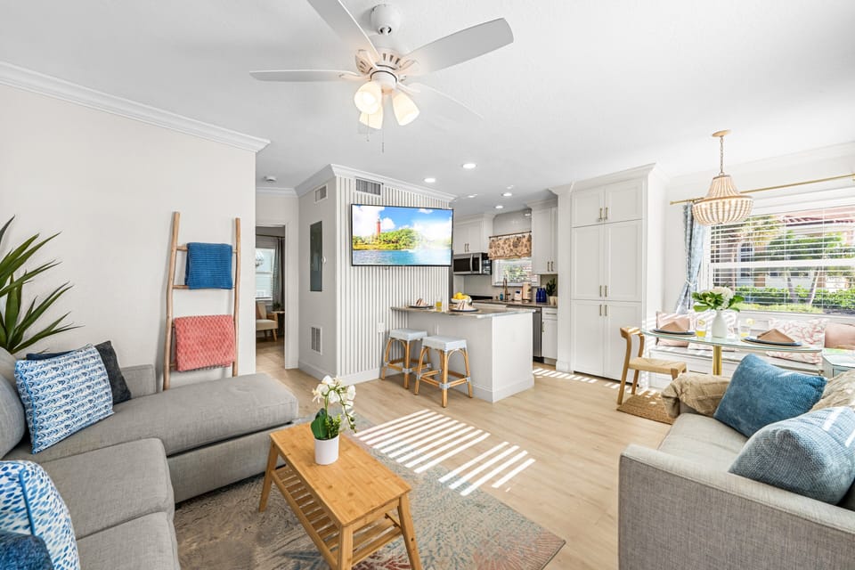 The kitchen flows seamlessly into the living and dining spaces, creating an open-concept layout that makes it easy to cook, dine, and relax together.