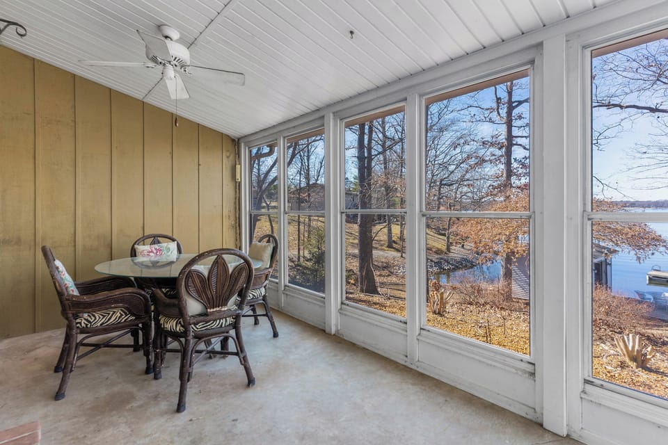 Enclosed patio with waterfront views