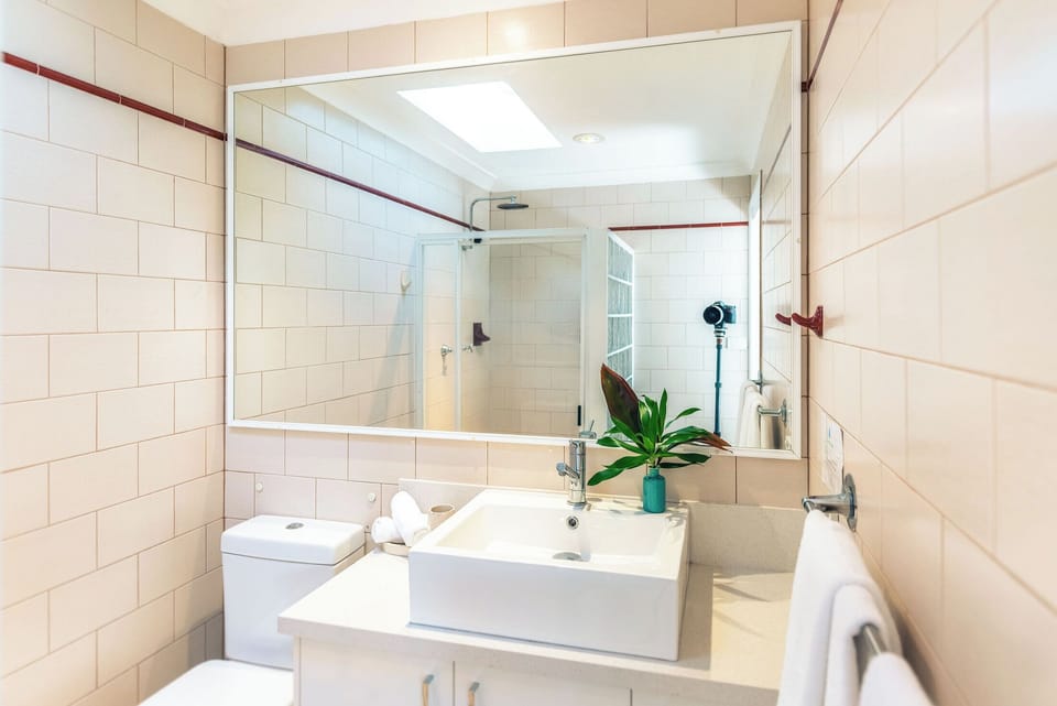 Double Room, Lake View | Bathroom | Shower, hair dryer, bathrobes, towels