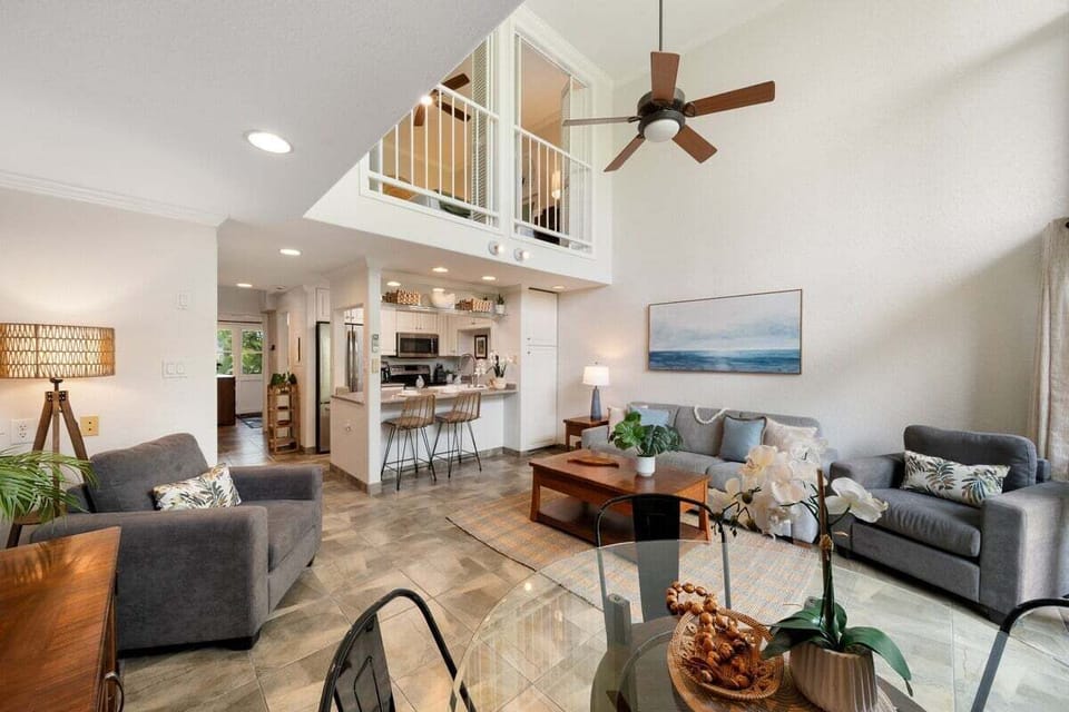 Stylish open‑concept living area with modern furnishings and lofted views.