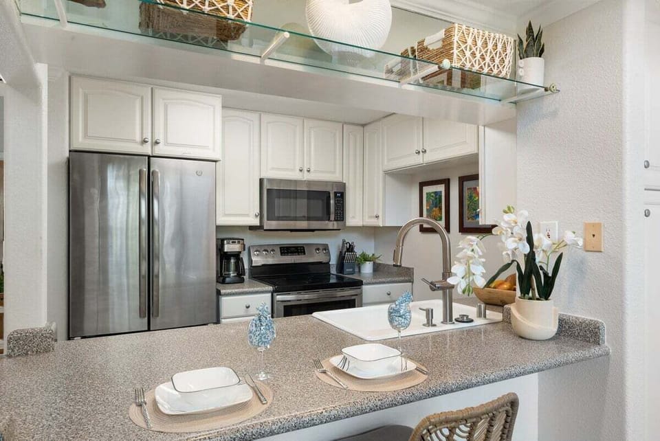 Modern kitchen with stainless appliances and island seating for easy meals.