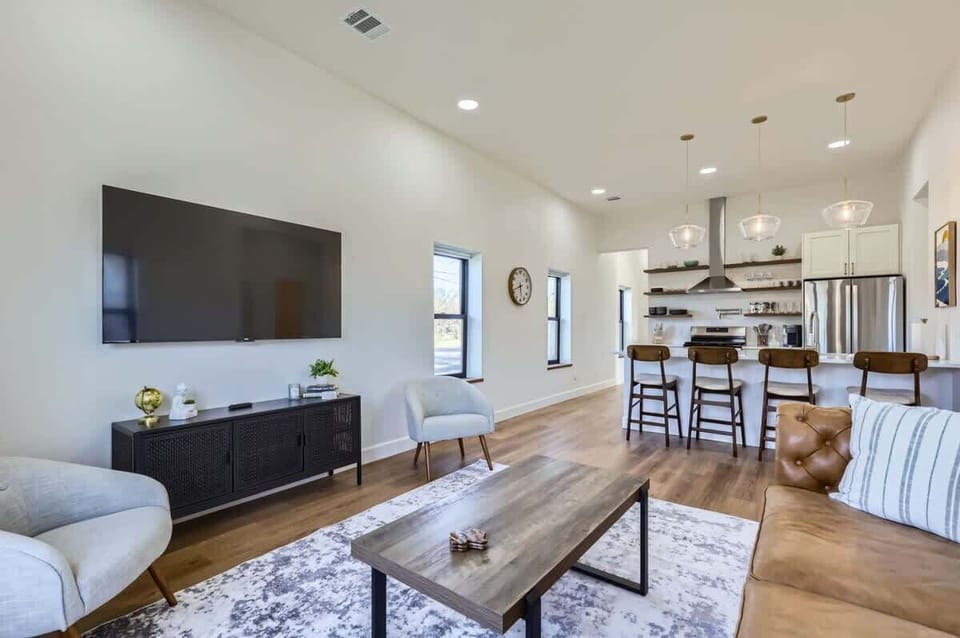 Equipped with a large TV, cozy seating, and space for everyone.