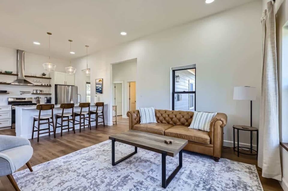 Cozy living room with plush seating and a large TV for movie nights or relaxing afternoons.