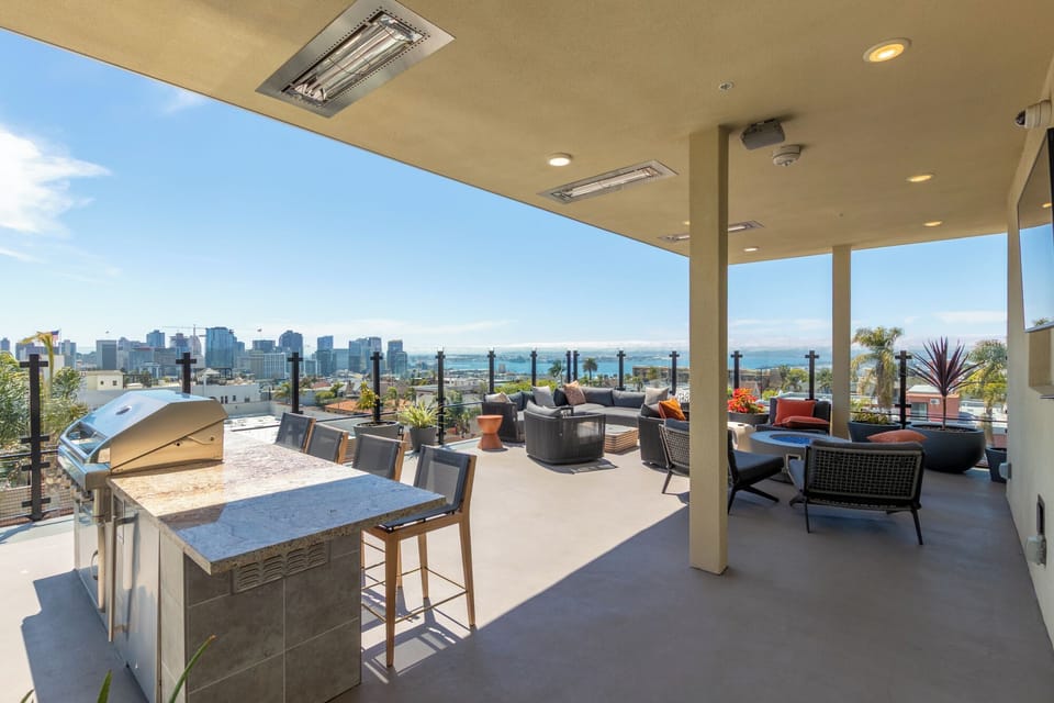Overhead heat lamps, Smart TV, and firepit all compliment the panoramic views.