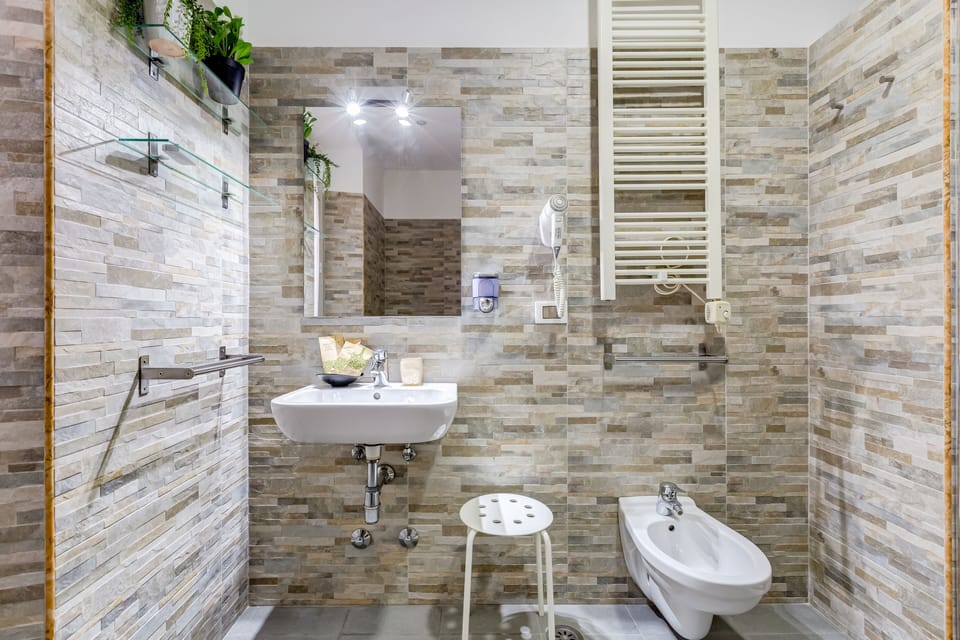 Superior Double Room, Private Bathroom | Bathroom | Rainfall showerhead, free toiletries, hair dryer, towels