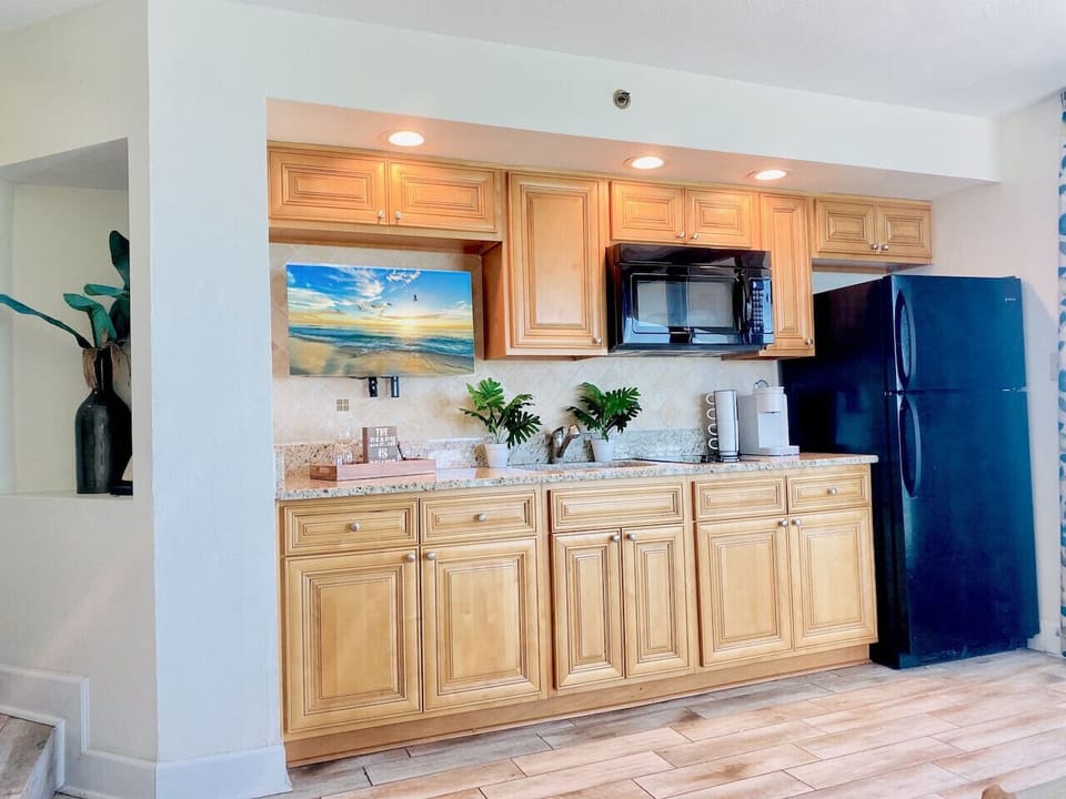 This stocked kitchen is the perfect space for preparing meals, making coffee, or warming up a quick dish or snack.  Equipped with refrigerator, microwave, two-burner stovetop, sink, and a Smart TV as well perfect for streaming your favorite shows.