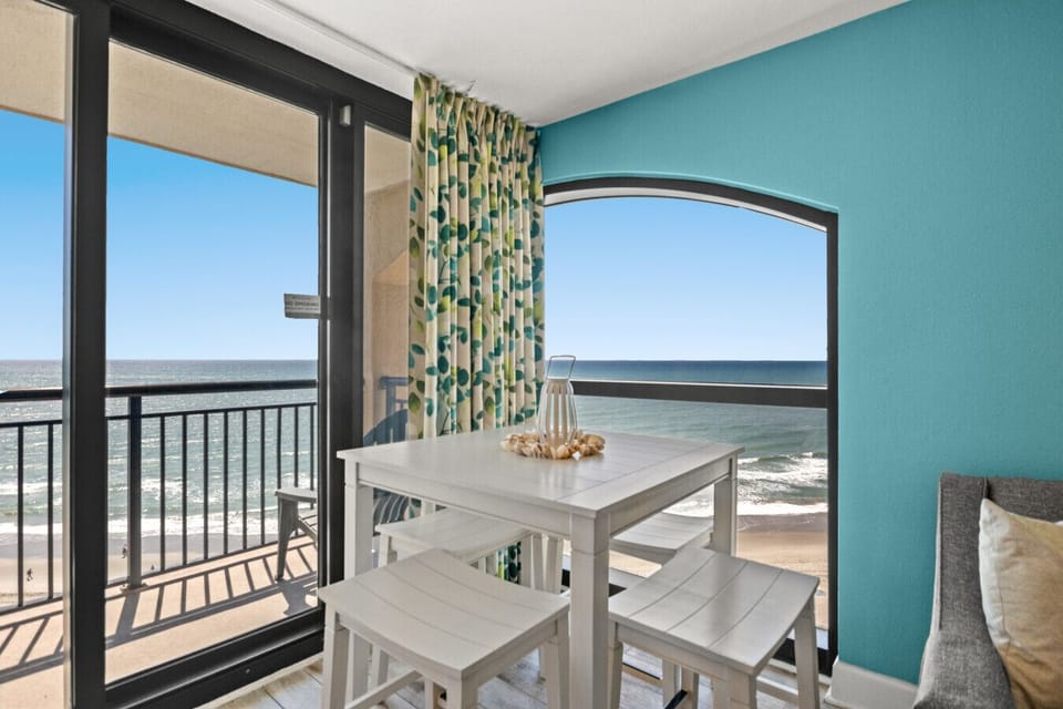 This dining area is the top spot to enjoy a beachfront dinner experience.  The natural floor to ceiling windows fill the room with a natural light and warms your heart with breathtaking views that are sure to help build lasting memories of North MB.