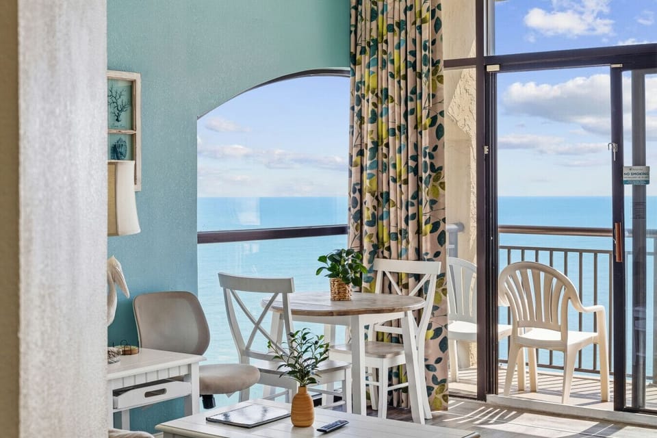Penthouse end-unit with breathtaking panoramic ocean views of North Myrtle Beach. Enjoy vibrant blue waters, endless skies, and a front-row seat to stunning sunrise views from this elevated coastal retreat.