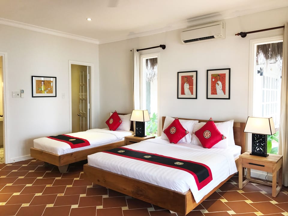 Family Triple Room, Beachfront | Minibar, in-room safe, desk, soundproofing